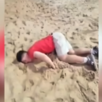 Lifeguard and bystanders assist a tourist lying on the sand at Ipanema Beach, Rio de Janeiro, after a reported drink-spiking incident.